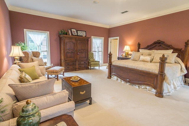 bedroom with visible vents, light colored carpet, and crown molding