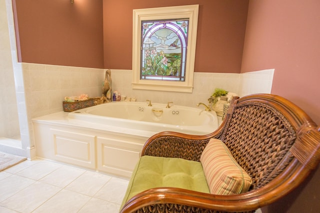 full bath with tile patterned floors and a bath