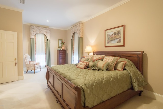 bedroom featuring visible vents, light colored carpet, baseboards, and ornamental molding