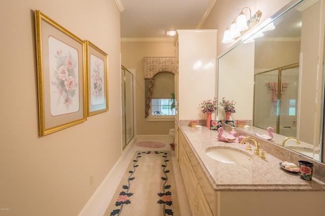 bathroom featuring toilet, a stall shower, vanity, and crown molding