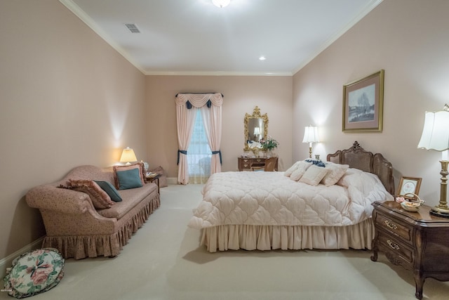 carpeted bedroom featuring visible vents, baseboards, and ornamental molding