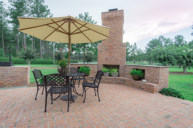 view of patio / terrace with an outdoor brick fireplace