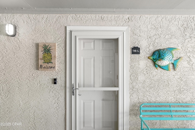 property entrance featuring stucco siding