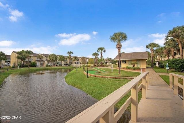 surrounding community with a residential view and a lawn