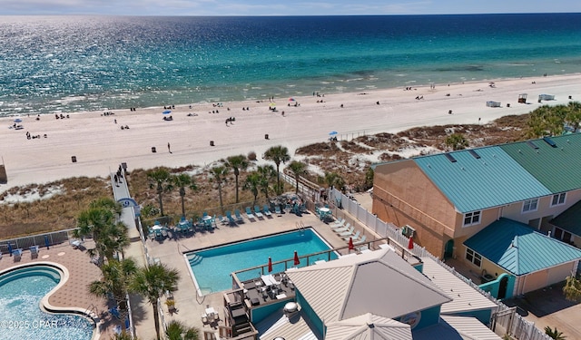 drone / aerial view featuring a beach view