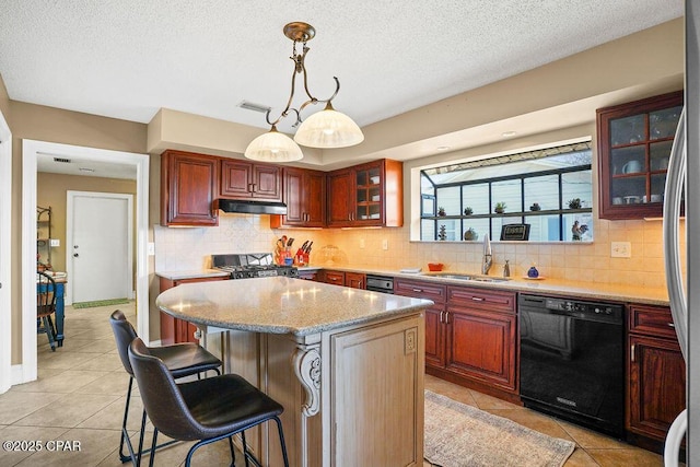 kitchen with a breakfast bar, black dishwasher, decorative backsplash, a sink, and under cabinet range hood