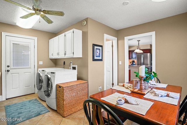 washroom with light tile patterned floors, ceiling fan, a textured ceiling, and separate washer and dryer