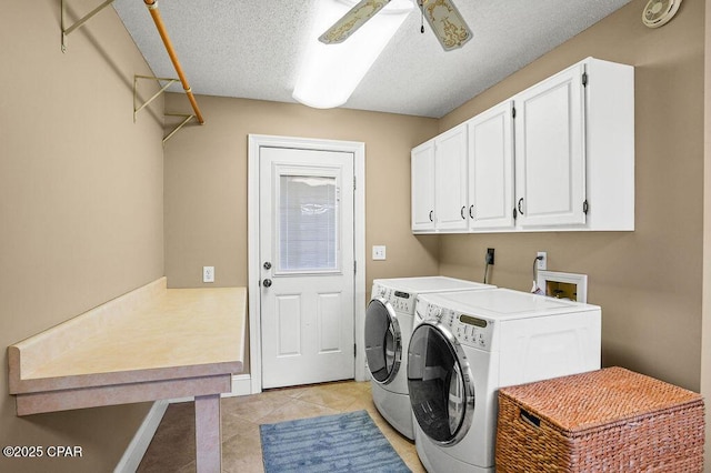 laundry room featuring light tile patterned floors, cabinet space, a ceiling fan, a textured ceiling, and washer and dryer