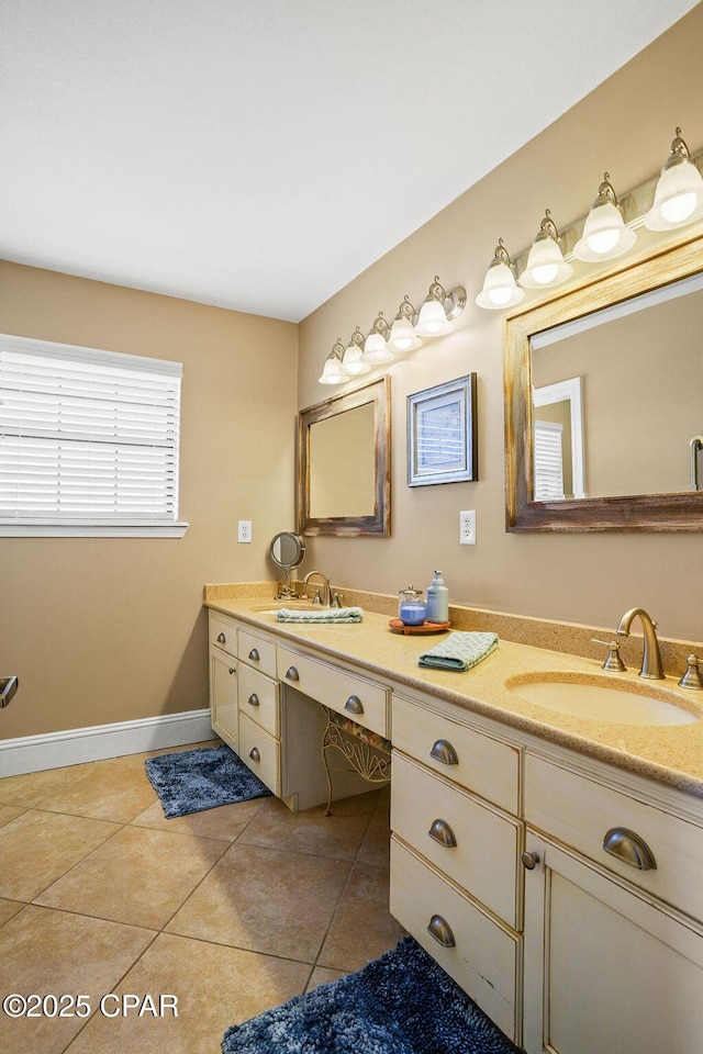 bathroom featuring double vanity, a sink, and tile patterned floors