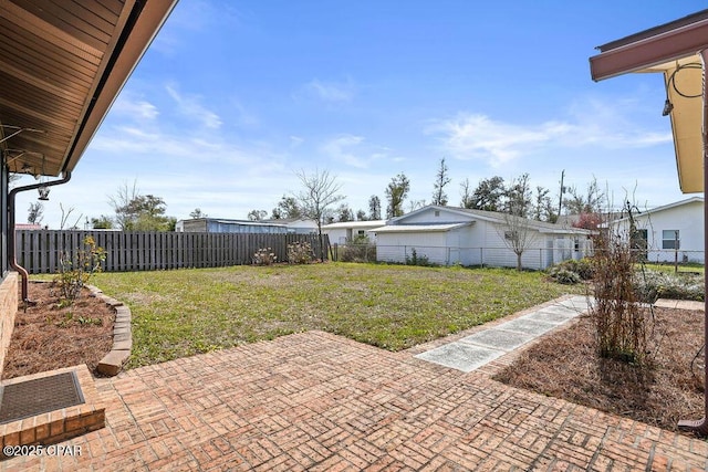 view of yard featuring a patio area and a fenced backyard