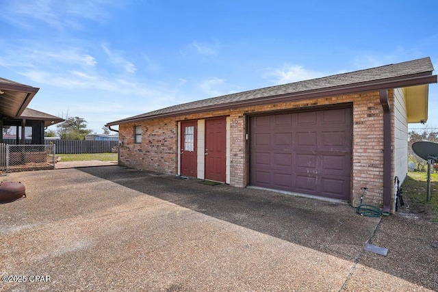 garage with fence