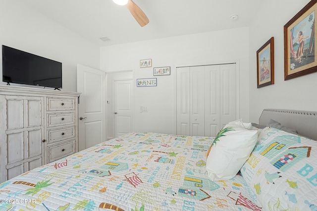 bedroom with ceiling fan and a closet