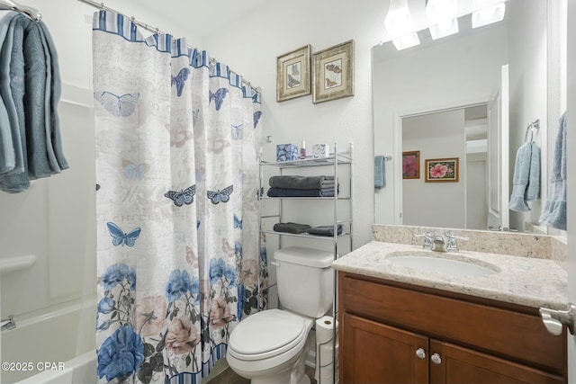 bathroom with toilet, shower / bath combo with shower curtain, and vanity