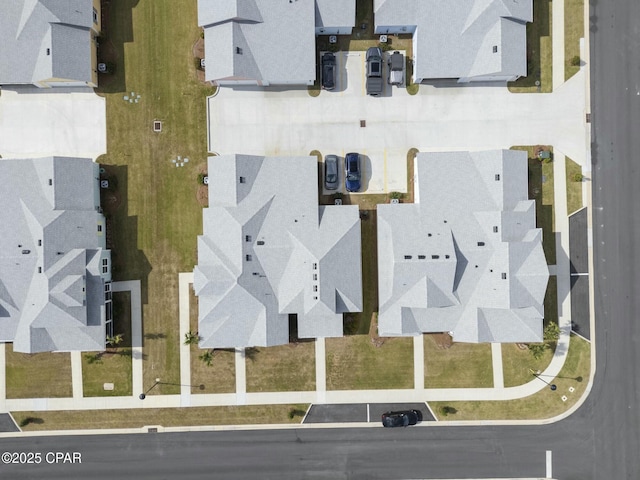 birds eye view of property with a residential view