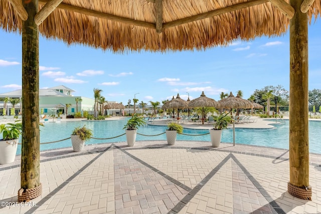 pool with a patio area and a gazebo