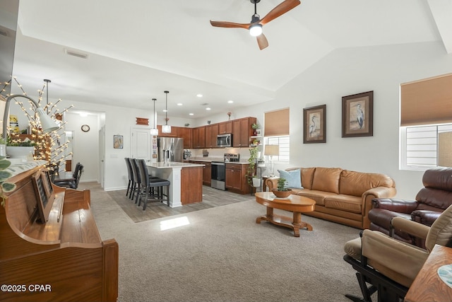 living room with recessed lighting, light colored carpet, visible vents, vaulted ceiling, and ceiling fan