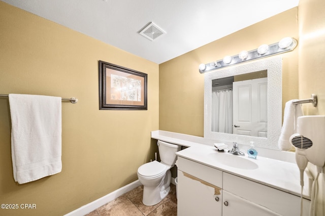 bathroom featuring tile patterned flooring, visible vents, baseboards, toilet, and vanity