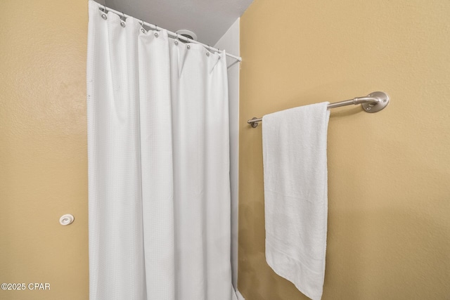 bathroom featuring a shower with curtain