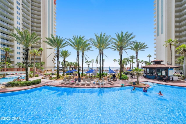 pool with a gazebo and a patio