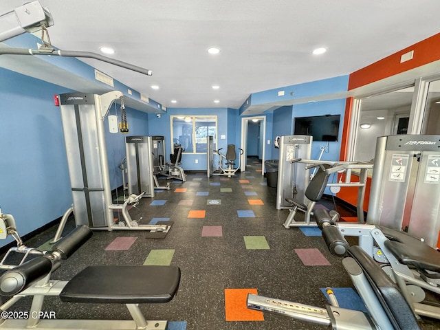 gym with recessed lighting and baseboards