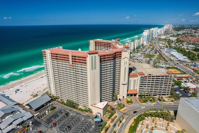 aerial view featuring a beach view, a view of city, and a water view