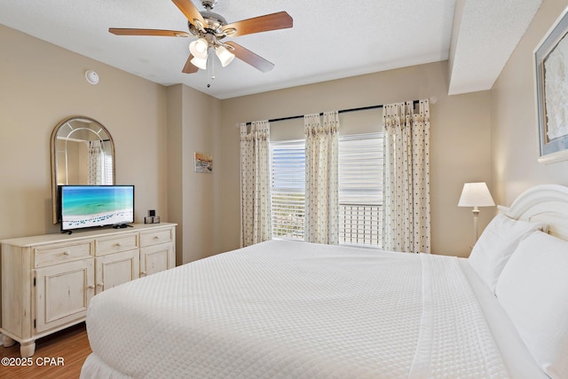 1160 Scenic Gulf Dr Unit A903, Miramar Beach, FL 32550 - bedroom with wood finished floors and ceiling fan