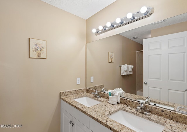 1160 Scenic Gulf Dr Unit A903, Miramar Beach, FL 32550 - bathroom featuring double vanity, visible vents, and a sink