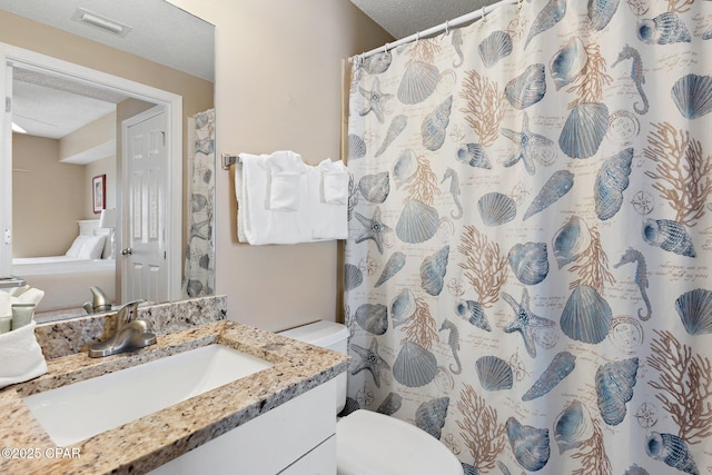 1160 Scenic Gulf Dr Unit A903, Miramar Beach, FL 32550 - bathroom with toilet, a textured ceiling, visible vents, and vanity