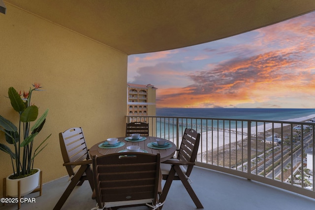 balcony with a beach view and a water view