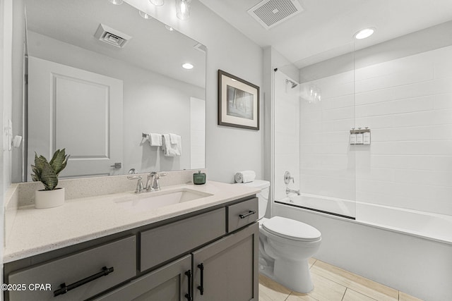 full bath featuring toilet, bathtub / shower combination, vanity, and visible vents