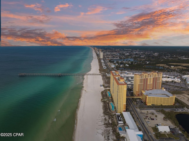 bird's eye view featuring a water view, a beach view, and a city view