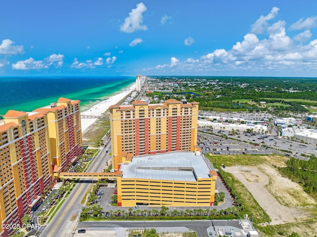 bird's eye view with a water view, a beach view, and a city view