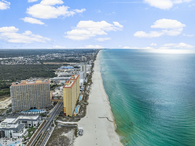 aerial view featuring a view of the beach, a water view, and a view of city