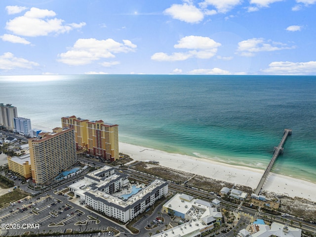 birds eye view of property featuring a view of the beach, a water view, and a view of city