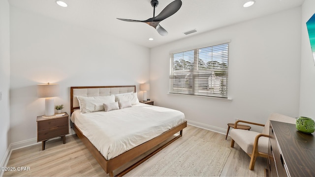 bedroom featuring light wood finished floors, recessed lighting, a ceiling fan, and baseboards