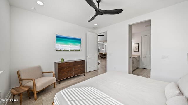 bedroom featuring light wood-type flooring, ceiling fan, ensuite bath, and recessed lighting