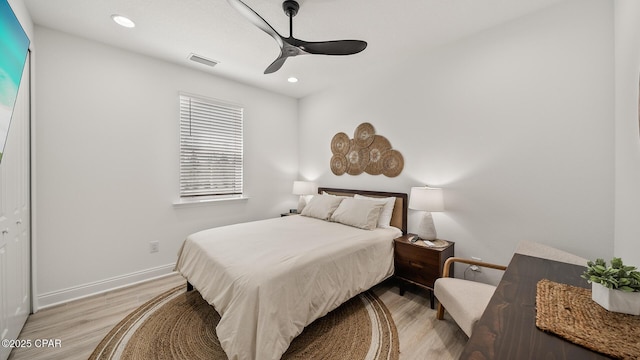 bedroom featuring recessed lighting, visible vents, light wood-style floors, a ceiling fan, and baseboards