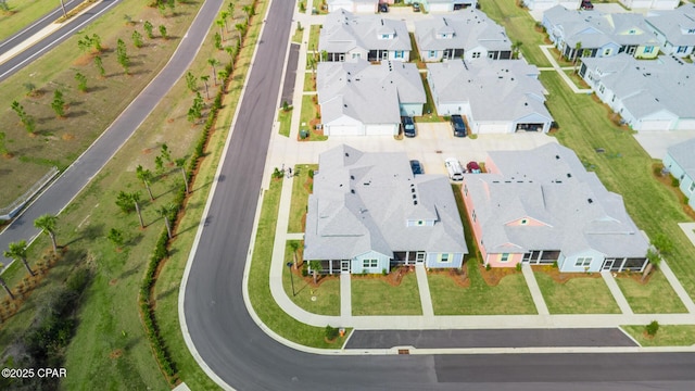 birds eye view of property with a residential view