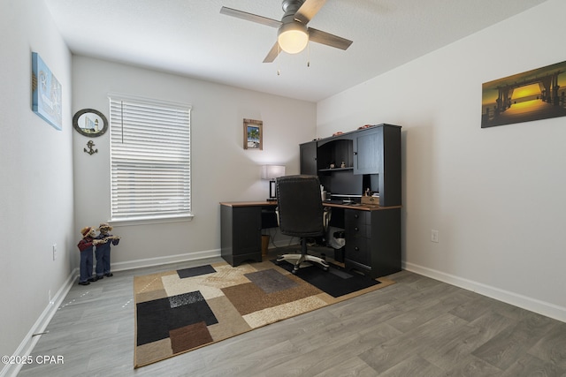 110 Spikes Cir, Southport, FL 32409 - office area with ceiling fan, light wood-style floors, and baseboards