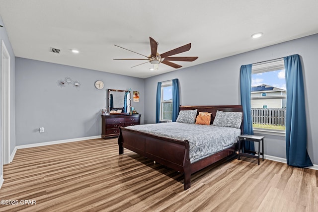 bedroom with visible vents, baseboards, ceiling fan, wood finished floors, and recessed lighting