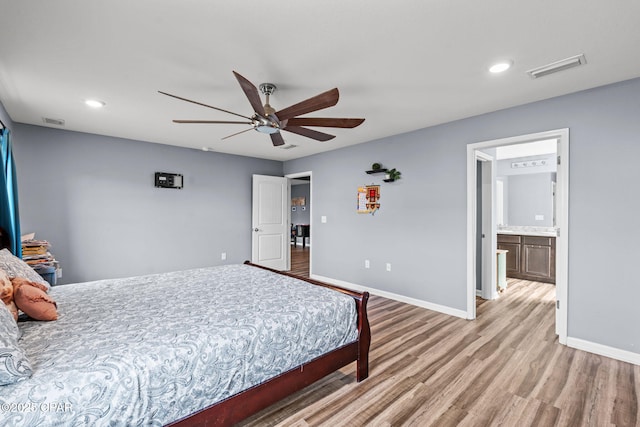 bedroom featuring recessed lighting, visible vents, light wood-style flooring, and baseboards