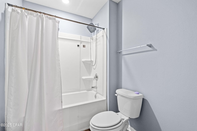 full bath featuring toilet and shower / tub combo with curtain