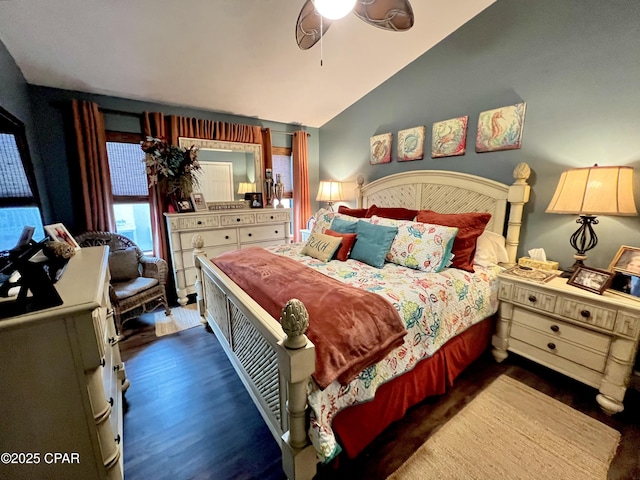 bedroom with vaulted ceiling and wood finished floors