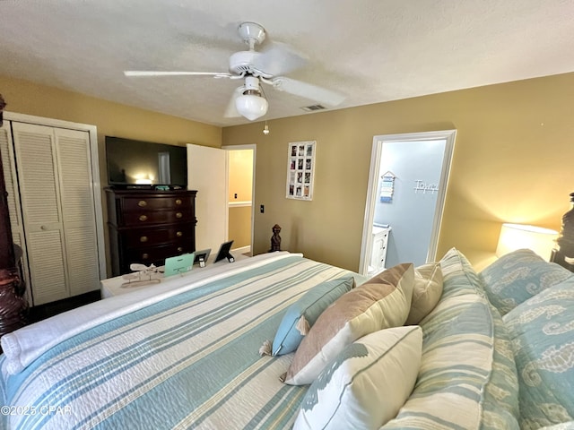 bedroom with ceiling fan, visible vents, and a closet