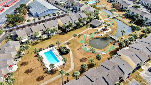 bird's eye view featuring a water view and a residential view