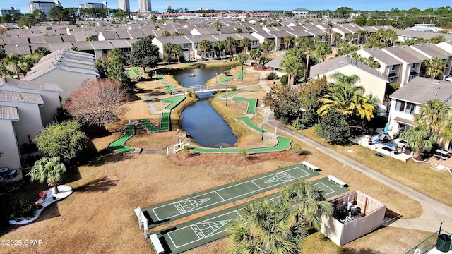 birds eye view of property with a residential view and a water view