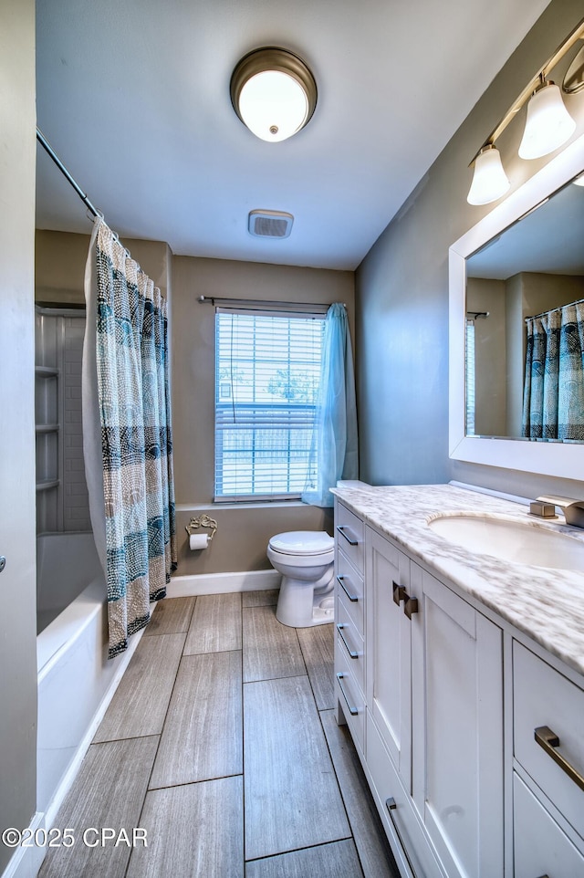 full bathroom with toilet, shower / tub combo, vanity, baseboards, and wood tiled floor