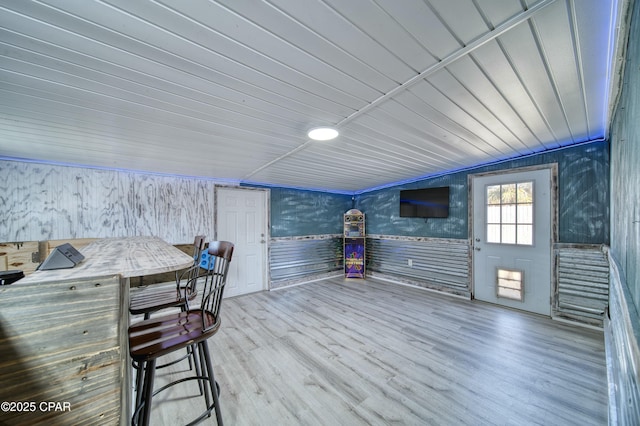 interior space with wood ceiling and wood finished floors