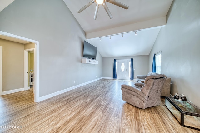 living room featuring high vaulted ceiling, wood finished floors, a ceiling fan, baseboards, and rail lighting