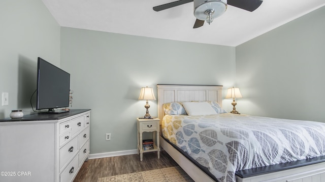 bedroom featuring a ceiling fan, dark wood-style flooring, and baseboards